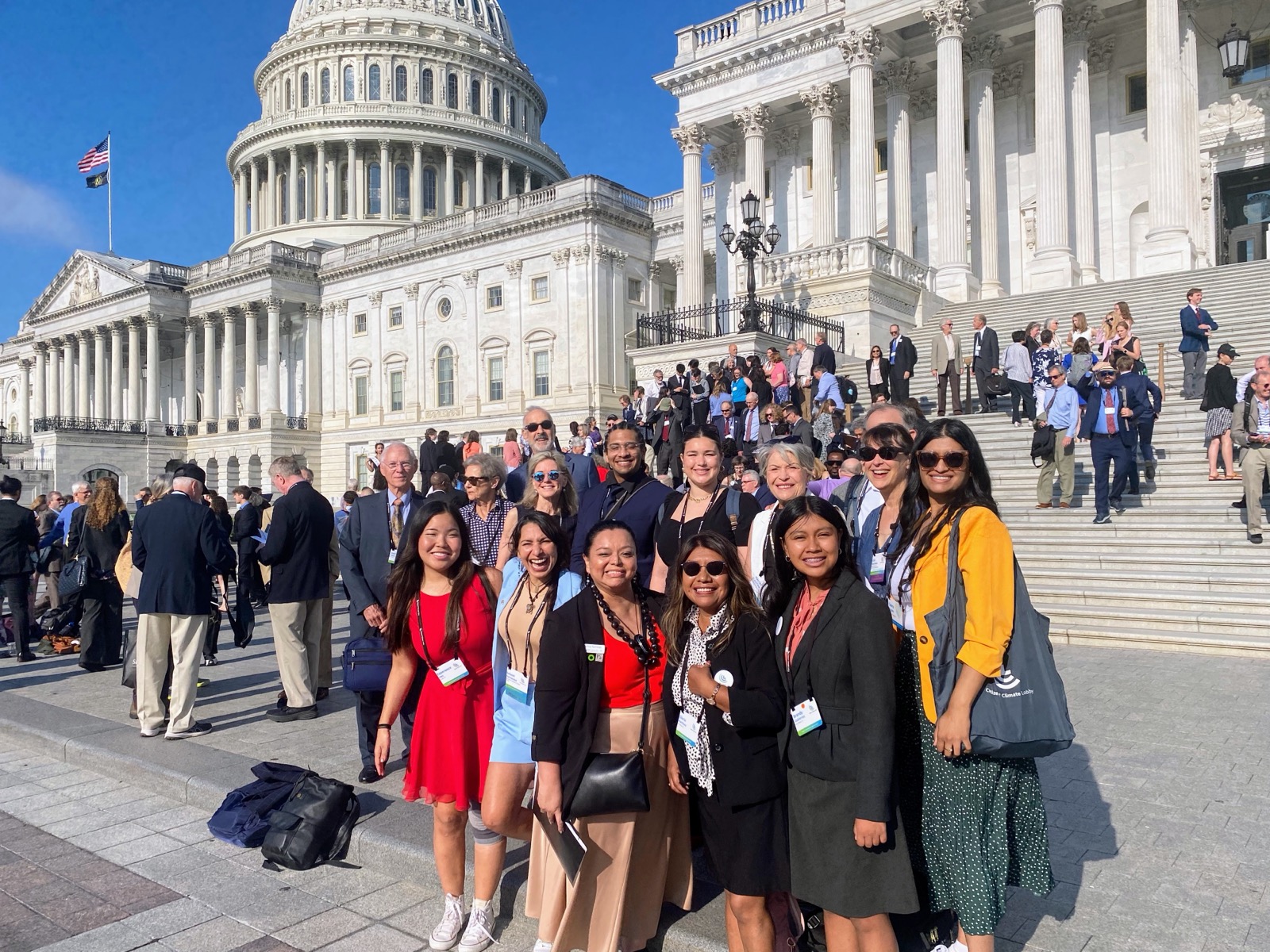 PGM Action Team members smiling together on the steps of the U.S. Capitol on Lobby Day