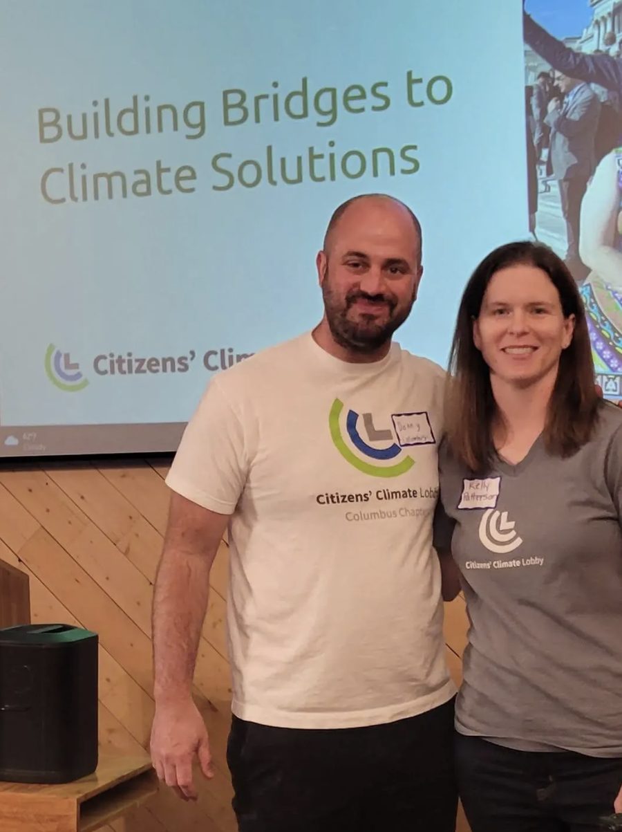 Two volunteers presenting a Building Bridges to Climate Solutions talk