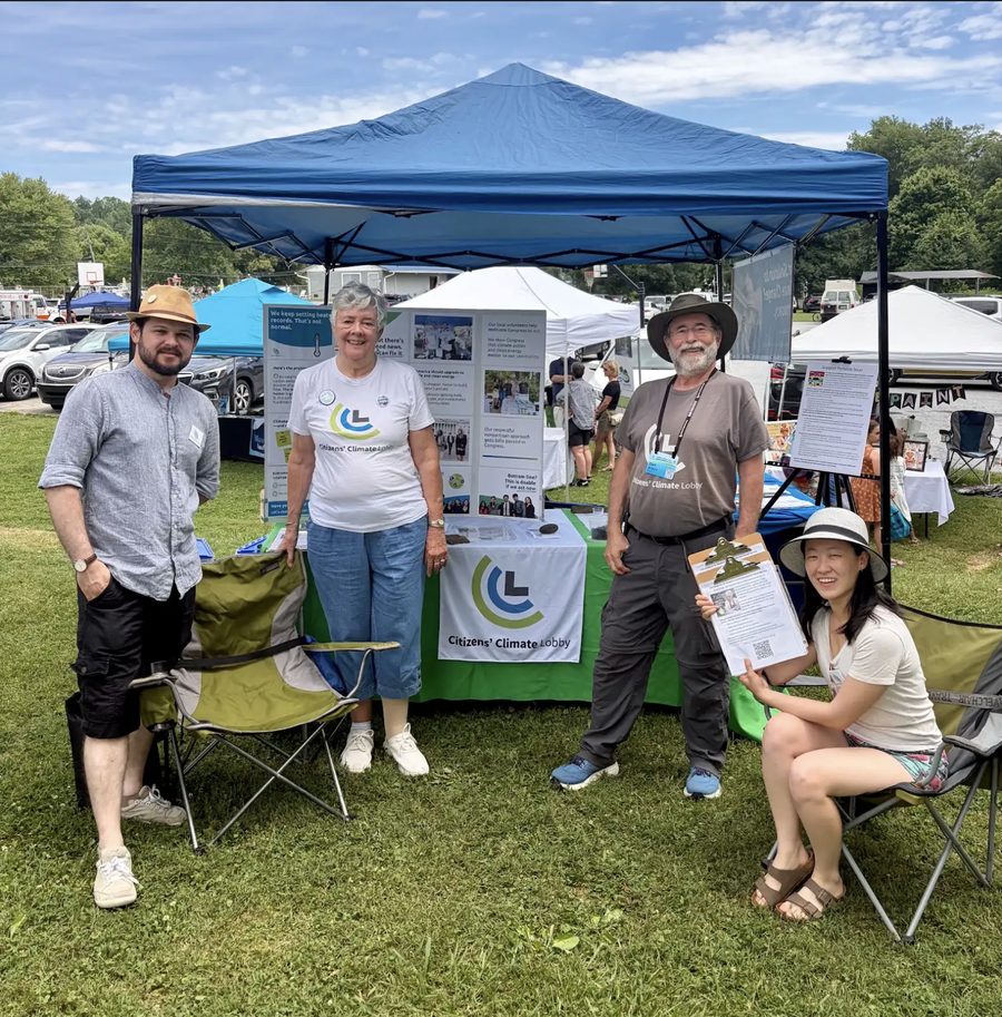 CCL volunteers staffing an outreach tent at a community fair