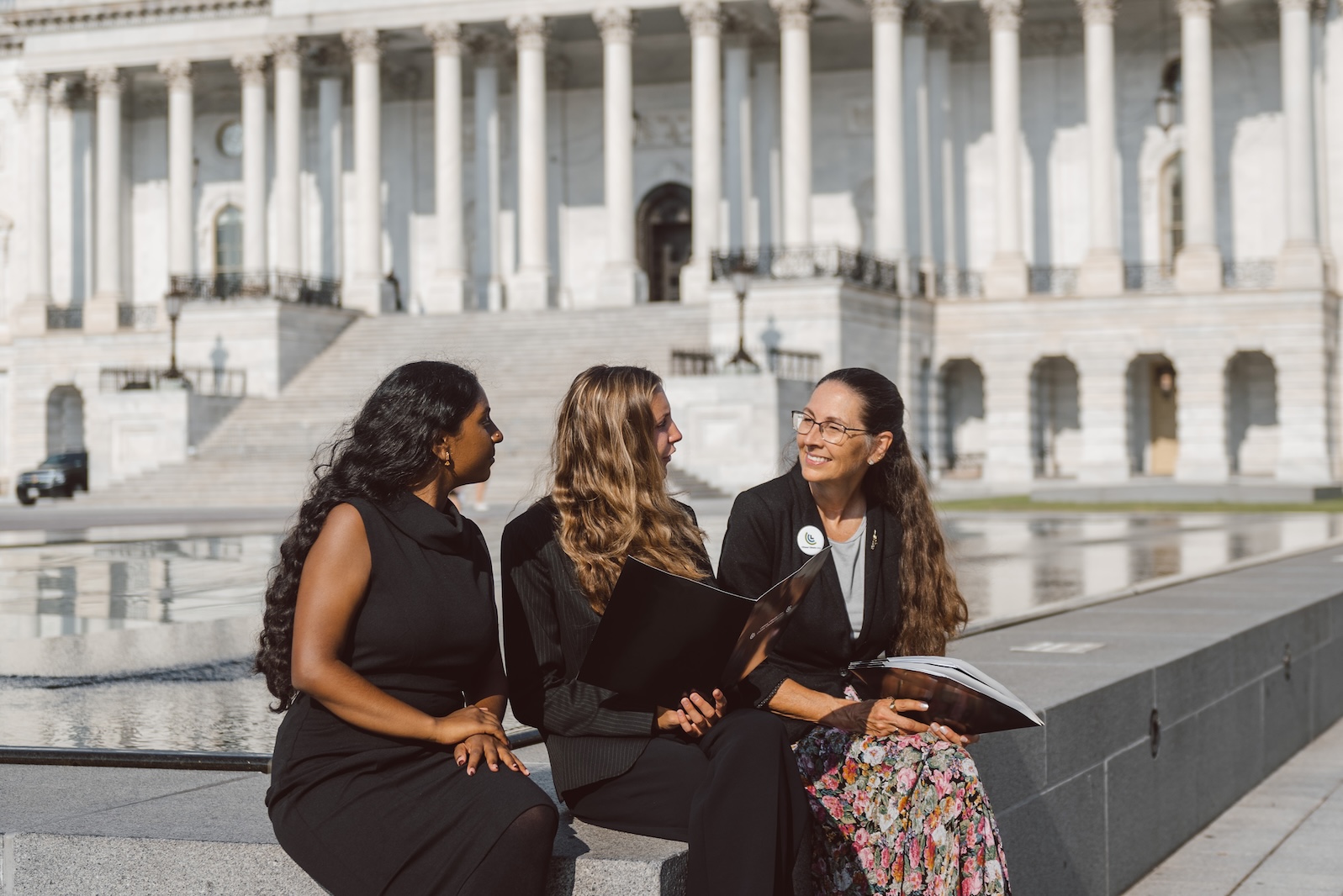 A CCL volunteer shaking hands with a Congressional staffer